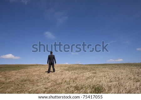 businessman looking away at the field