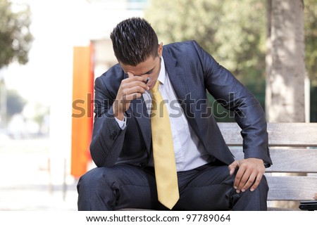 frustrated businessman smoking a cigar to relax
