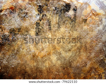 Grungy wall with shabby wallpaper closeup background.