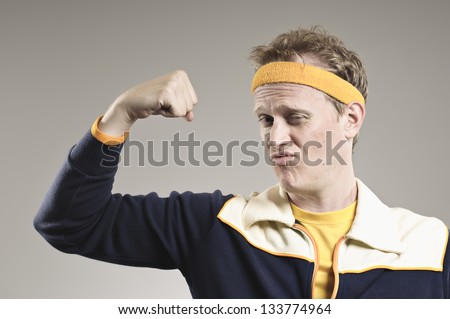 Retro Gym Coach Flexing His Pathetic Muscles