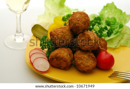 Meat balls on yellow plate