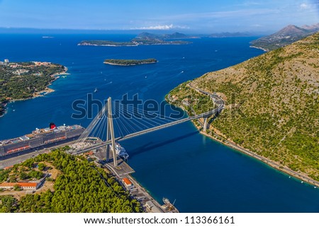 Aerial helicopter shoot of Dubrovnik bridge - entrance to the city