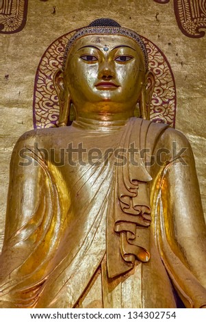 BAGAN, MYANMAR - FEB 22: Ancient golden Buddha statue  in Ananda Temple (Indian Style Structure) on Feb 22, 2012 in old Bagan, Myanmar. Built around 1105 by King Kyanzittha