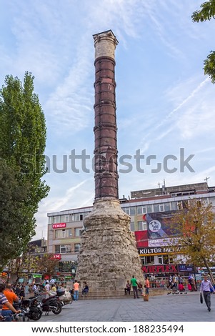 ISTANBUL, TURKEY - SEPTEMBER 27, 2013: People gather around The Column of Constantine (Burnt Column). It is monumental tourist attraction.