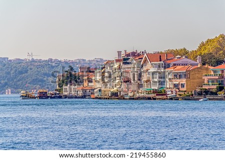 ISTANBUL, TURKEY - SEPTEMBER 29, 2013: Panoramic view of the old waterfront houses in Yenikoy.