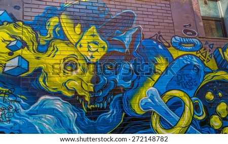 MELBOURNE, AUSTRALIA - MARCH 21, 2015: Colorful graffiti detail in back alley of downtown.