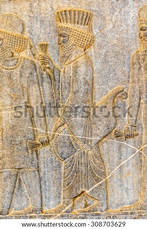 Persian nobleman on their way to the royal feast relief detail on the stairway facade of the Apadana at the old city Persepolis.