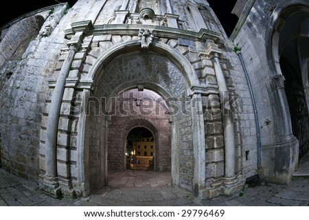 Main entrance to the old medieval town Korcula  by night. Croatia, Europe. Fish eye lens shot.
