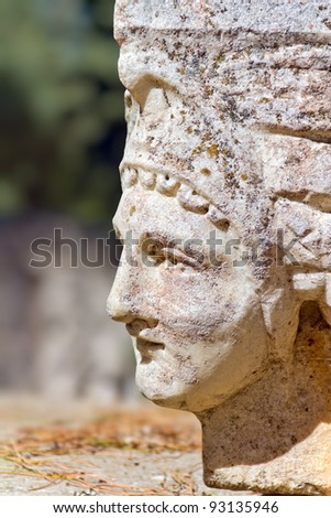 Building relief detail of architectural frieze with woman head in Aphrodisias (Turkey).