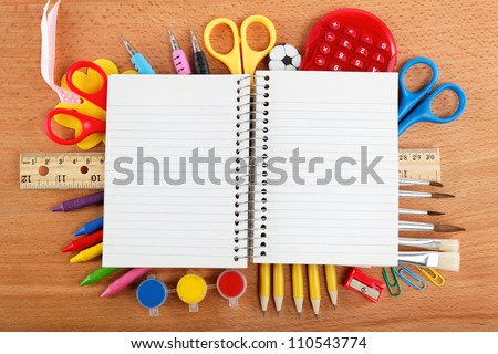 office and student accessories on wooden background. Back to school concept