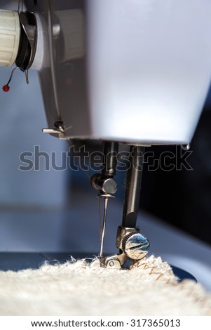 Sewing machine and fabric close up.