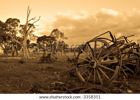 sepia image of an old cart left to rot on the farm