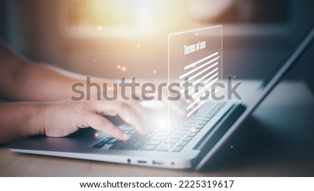 Man using a laptop with a graph of Terms of use concept, online banking check budget planning concept banner for website header design,Terms of use business concept. Terms and conditions of contract. Photo stock © 