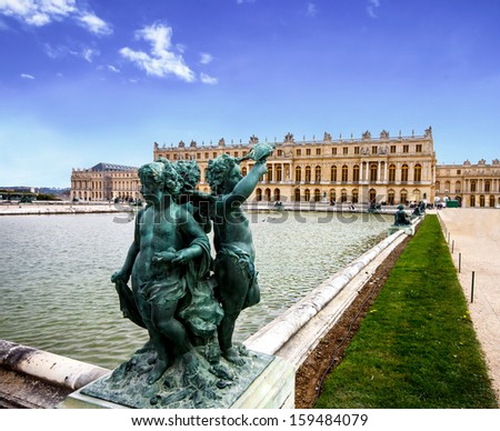 bronze sculpture in the garden of Versailles palace near Paris, France with blue sky