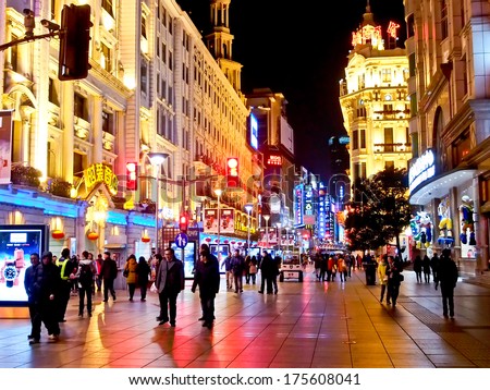 SHANGHAI JANUARY 21: Tourists at the famous shopping street, Nanjing road,  in Shanghai, China on Jan 21, 2014. Nanjing Road is one of the world\'s busiest shopping streets.