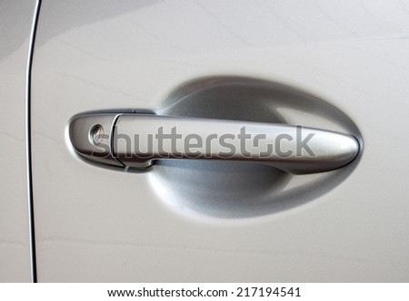 car\'s door opening handle, grey color