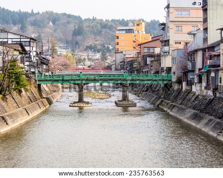 GIFU-APR 17: old green bridge in Takayama old town area in Gifu prefecture, Japan on April 17, 2014. Takayama is best known for its inhabitants\' expertise in carpentry in Japan.