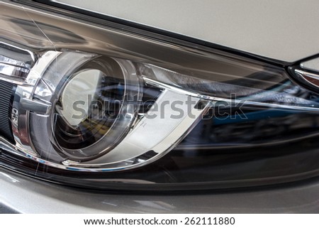 closeup image of a modern car head lamp