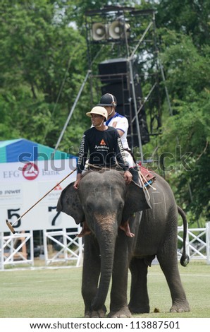 HUA HIN, THAILAND -SEPTEMBER 13: Unidentified polo players play in elephant polo games during the 2012 King \'s Cup Elephant Polo match on September 13, 2012 at Suriyothai Camp in Hua Hin, Thailand