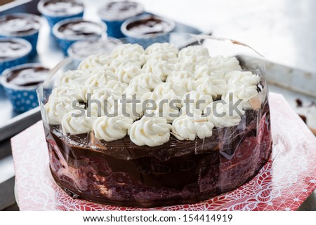 Chocolate cake butter with plastic wrap on processing