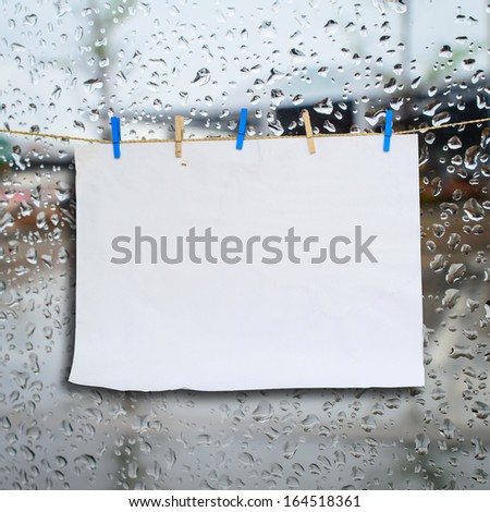 Clothes peg and paper notes with clipping path on rain drop mirror