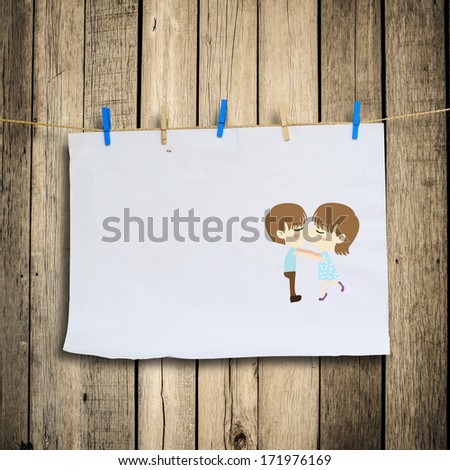 Boy kiss girl on with Clothes peg and paper notes with clipping path