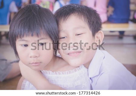 Brother hug his sister with love