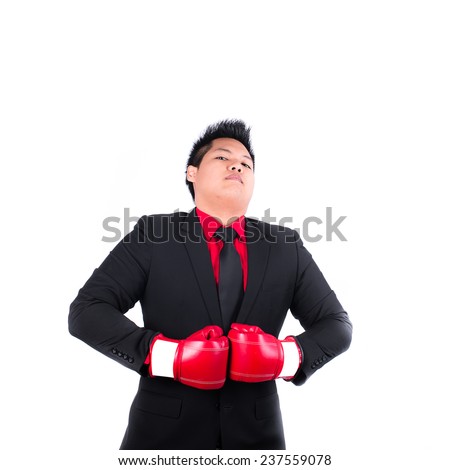 businessman with red boxing glove ready to fight with problem, business concep