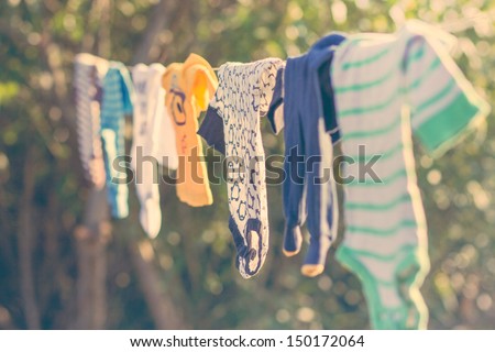Baby laundry hanging on a clothesline