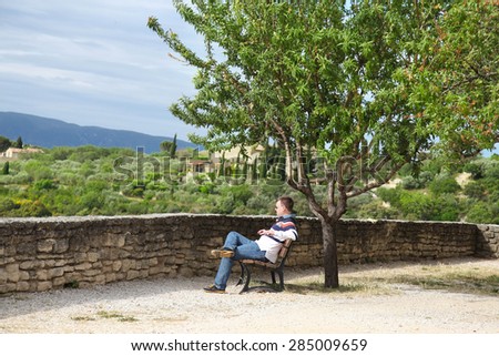 Young man enjoys view of Provence
