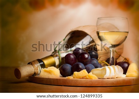 Gourmet food background, border with wine, cheese and grapes
