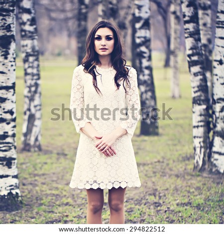 Pretty Girl Fashion Model Outdoors. Woman in Lace Dress