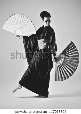 Young japanese woman with fans. Black and white film style colors.