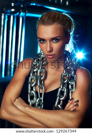 Young sports woman with heavy chain fashion portrait.