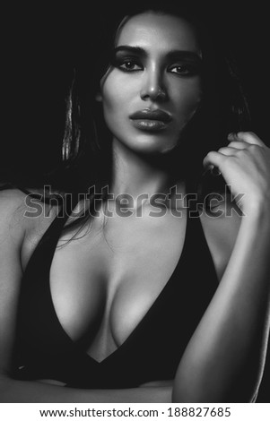 Young sexy woman portrait. Black and white film style.
