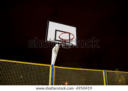 Basketball basket. Dark night scene.