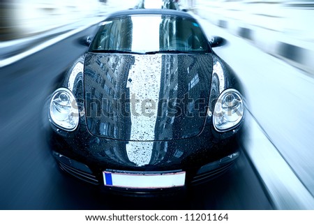 Sport car with special zoom blur effect. Blue tint.