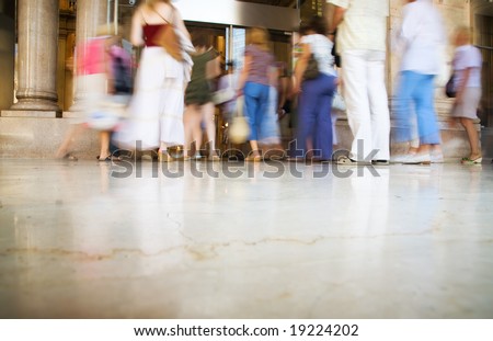 People entering into modern shop. Blurred motion.
