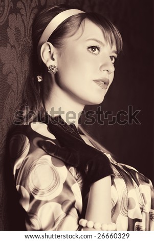 Young woman retro style portrait. Sepia colors.