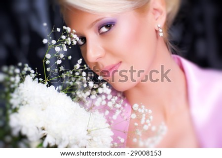 Young romantic woman with flowers portrait. Selective focus effect. Focus on center.