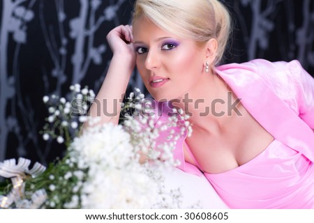 Young romantic woman with flowers portrait.