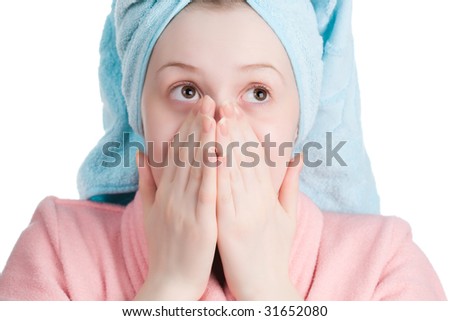Young woman with towel and dressing gown wondering. Isolated on white.