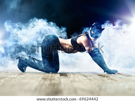 Woman in cat suit with smoke effect.