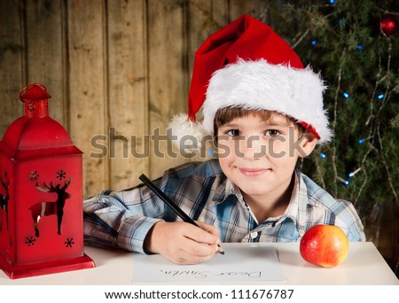 Boy writes a letter to Santa