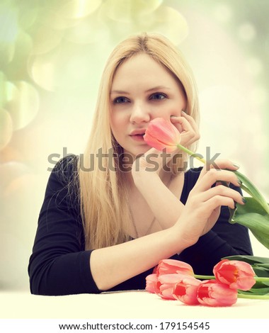 girl smelling a flower