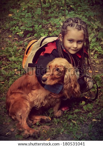 little girl on a walk with the dog