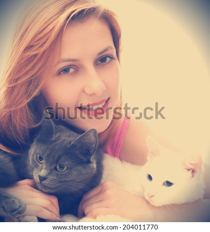 woman with two cats