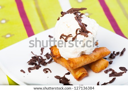 fried custard wrapped lumpia wrapper topped with vanilla ice cream and shaved truffle chocolates