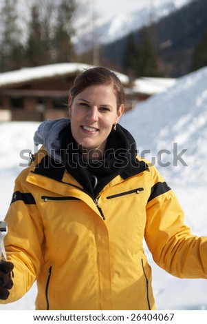 A young woman outdoor in a winter setting. The active woman is about to go crosscountry skiing.