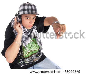 A young DJ is pointing up. He is listening to music on his headphones! Isolated over white.